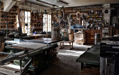 Photograph of an older looking, small, woodworking workshop
